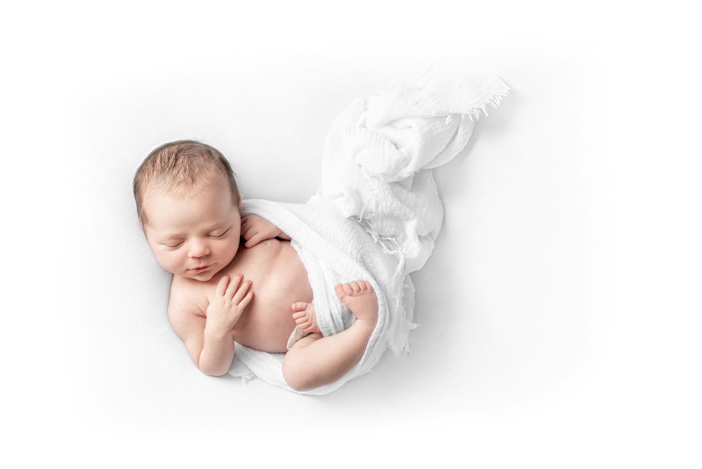 baby in white wrap photo